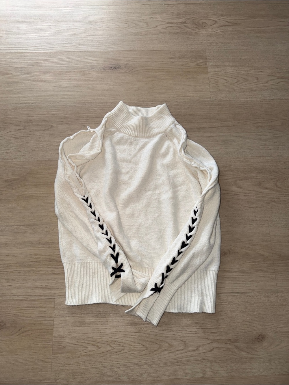 1. State Cream Cold-Shoulder Turtleneck Sweater with Black Lace-Up Detail
